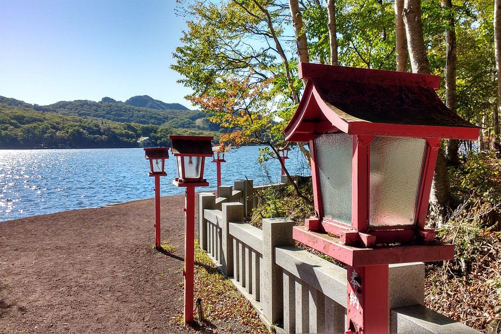 Lanterns infront of lake at Akagi Shrine