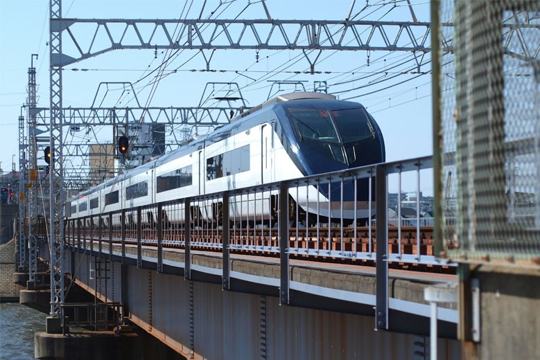 The Narita Skyliner going over a bridge, heading from Narita Airport to Tokyo.