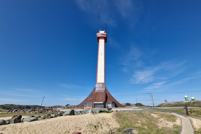 Wakkanai Centennial Memorial Tower with a blue sky behind it